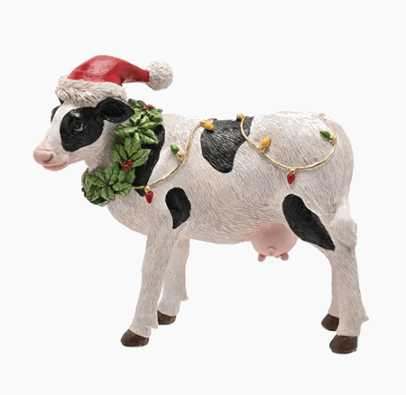 Figur ku med julelys klar for jul