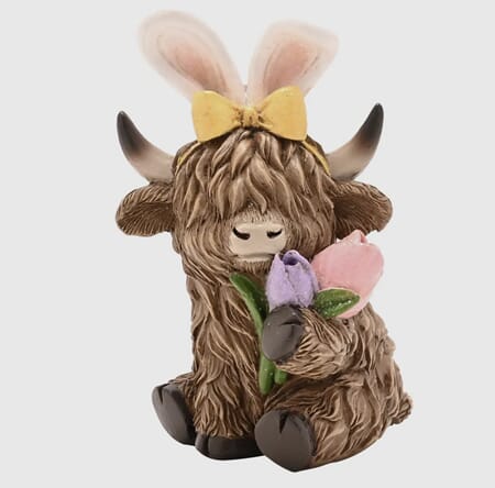 Figur ku med blomst påske