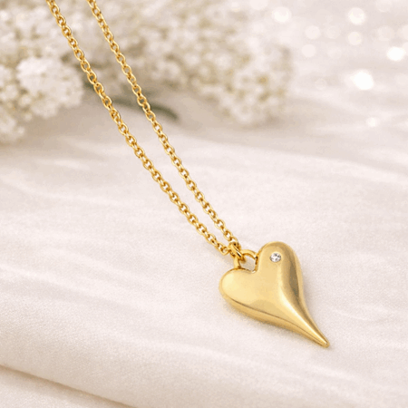 Langt smykke gullfarget lykke